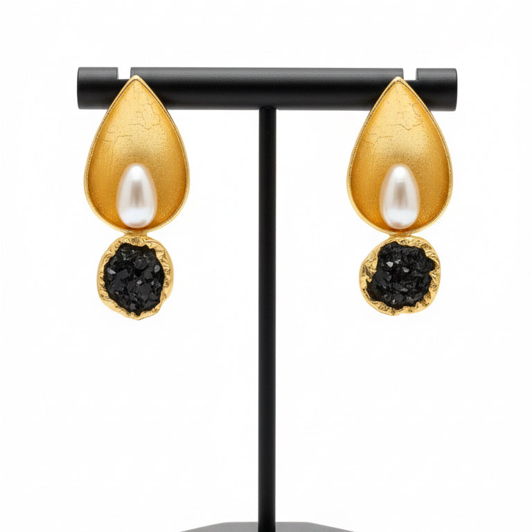 Gold leaf earrings with pearl and dark stone center