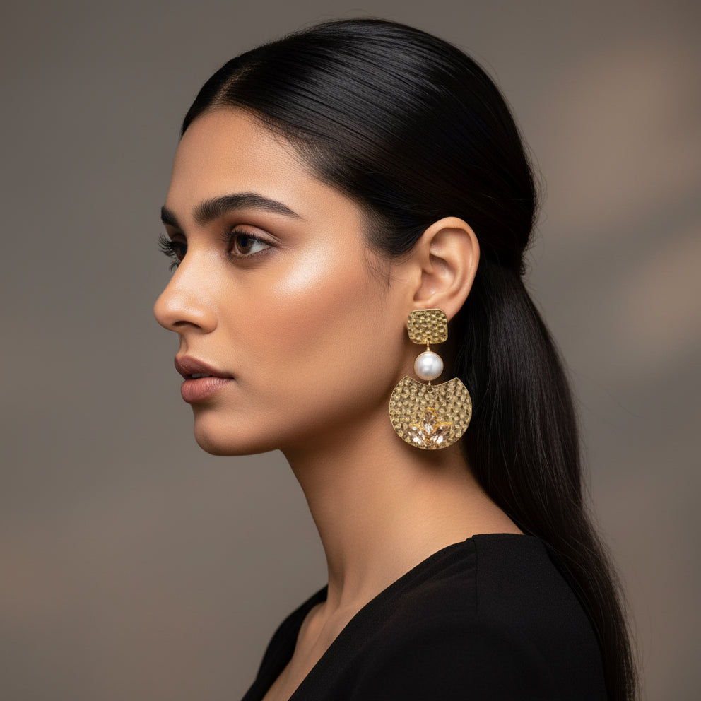 Gold earrings with pearl and leaf-like stone design