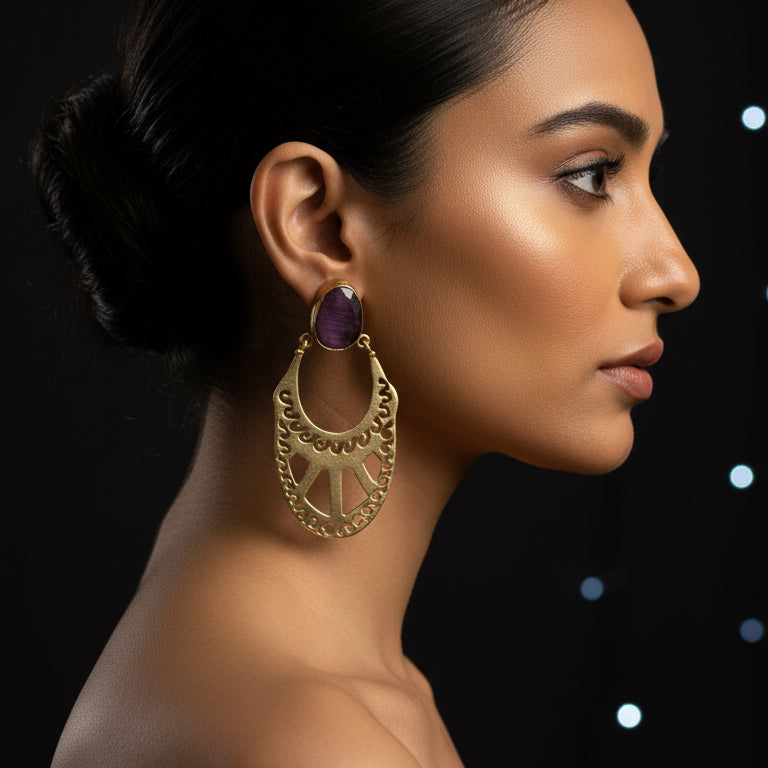 Gold hoop earrings with purple stones