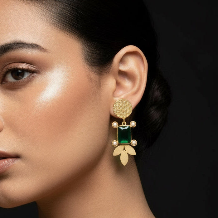 Woman wearing gold earrings