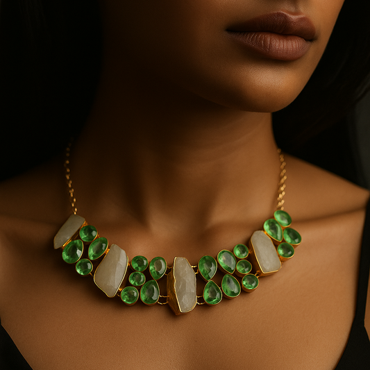 Necklace with green and white stones worn by a person against a dark background