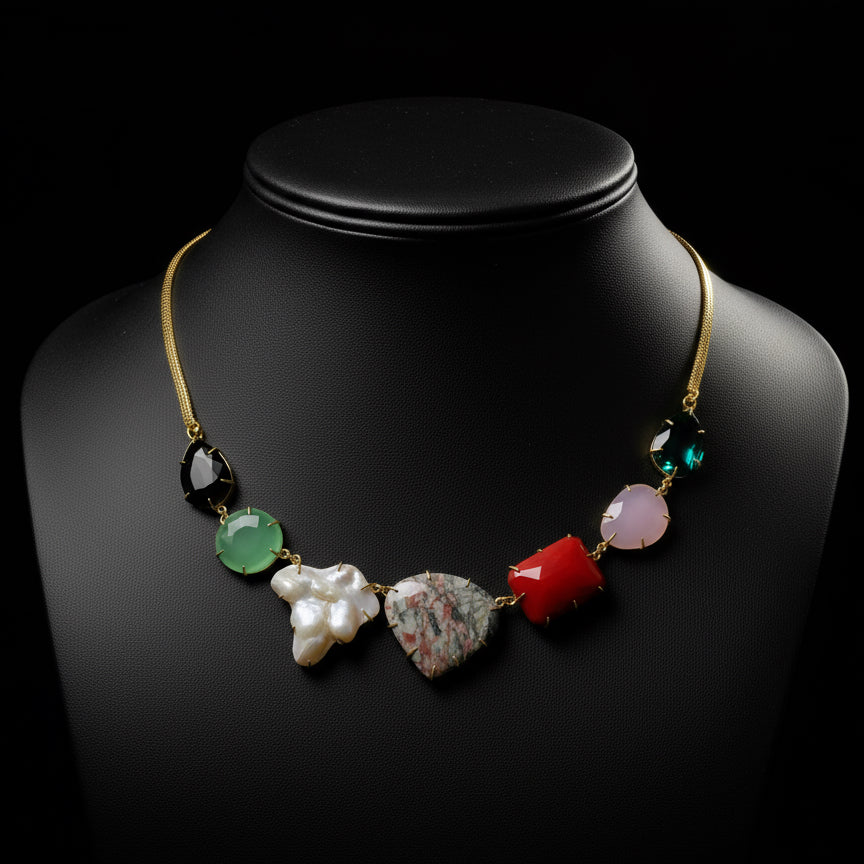 Brass necklace with colorful beads on a black  background