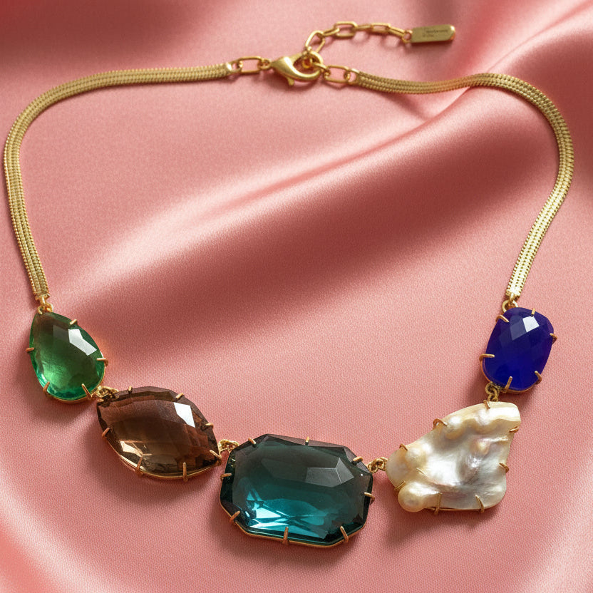 Necklace with colorful stones on a light gray background