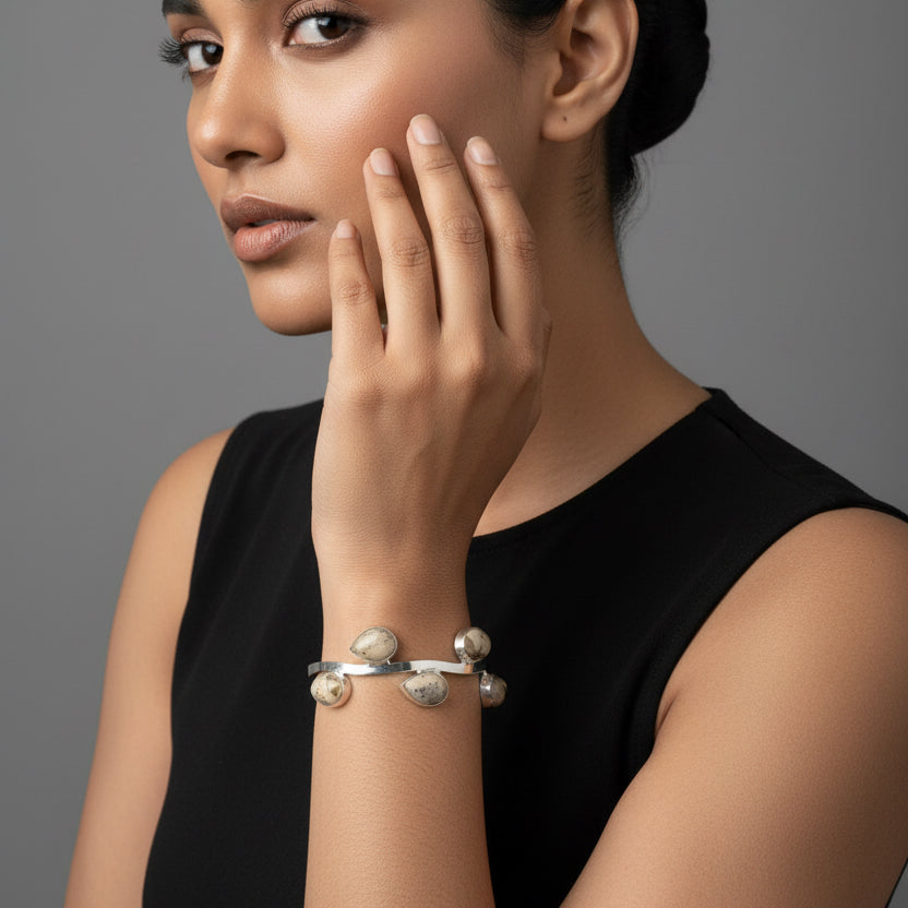 Silver Plated bracelet on a wrist with a background