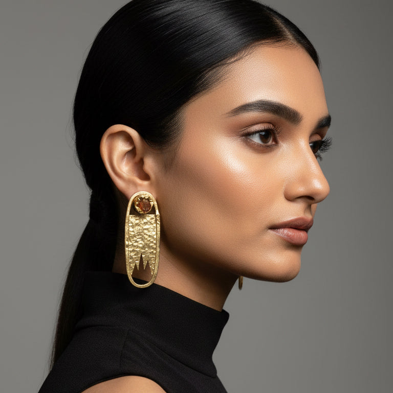Pair of gold earrings with embedded stones 