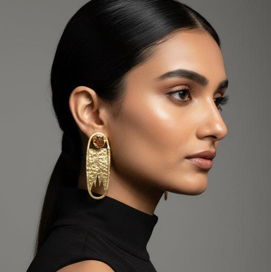 Pair of gold earrings with embedded stones 