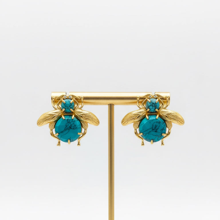 Gold bee-shaped earrings with turquoise stones