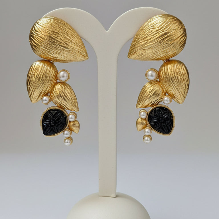 Pair of gold and black earrings 