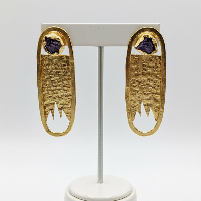 Pair of gold earrings with purple stones 
