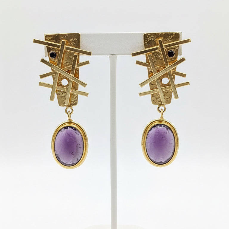 Gold earrings with purple stones 