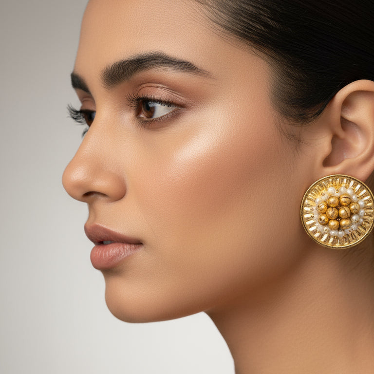 round Studd with pearls in the middle 