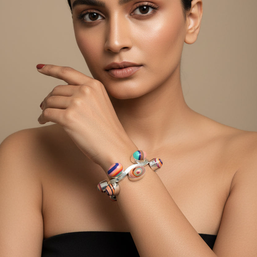Colorful beaded bracelet on a wrist with a blurred background
