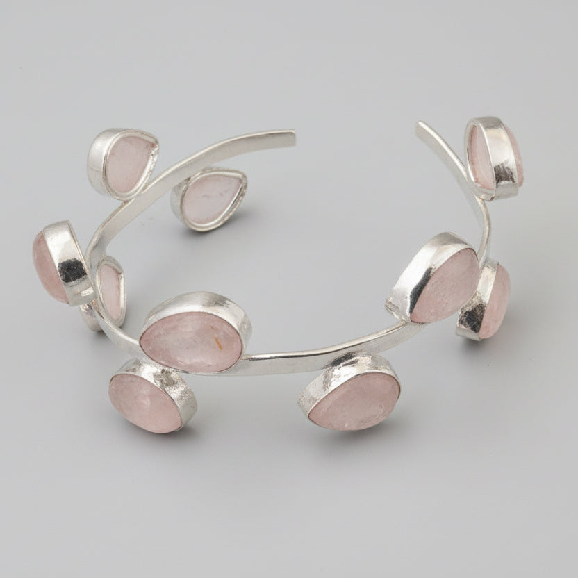 Silver bracelet on a black surface