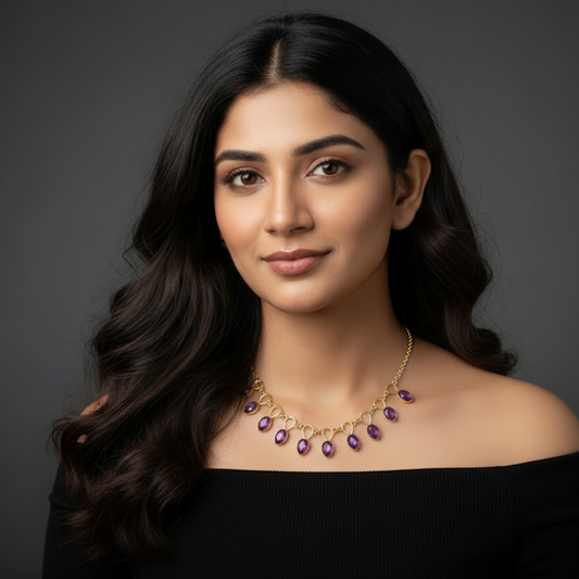 Woman wearing a necklace against a dark background